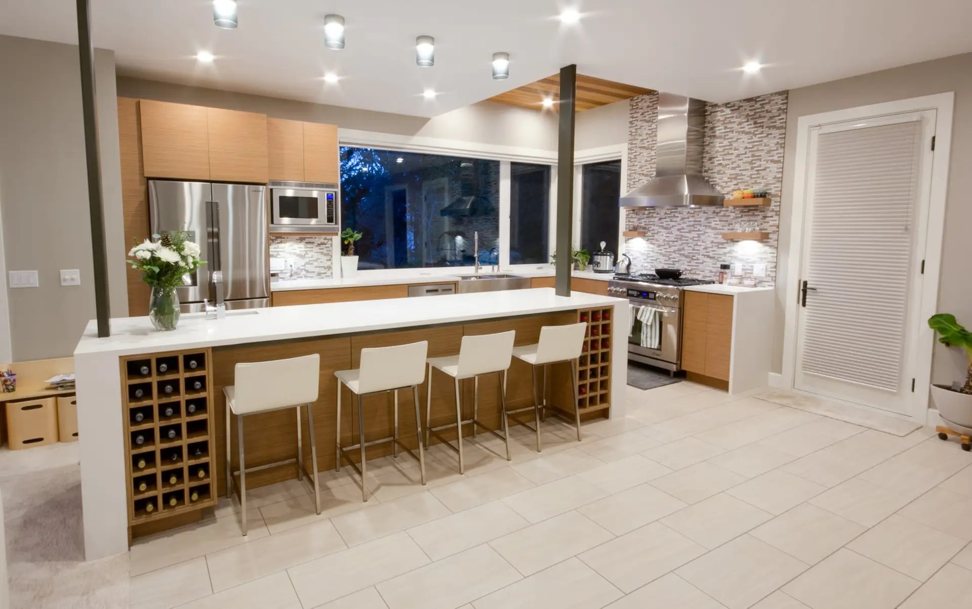 Modern custom home featuring elegant custom cabinets with sleek finishes and ample storage in the kitchen and living areas.