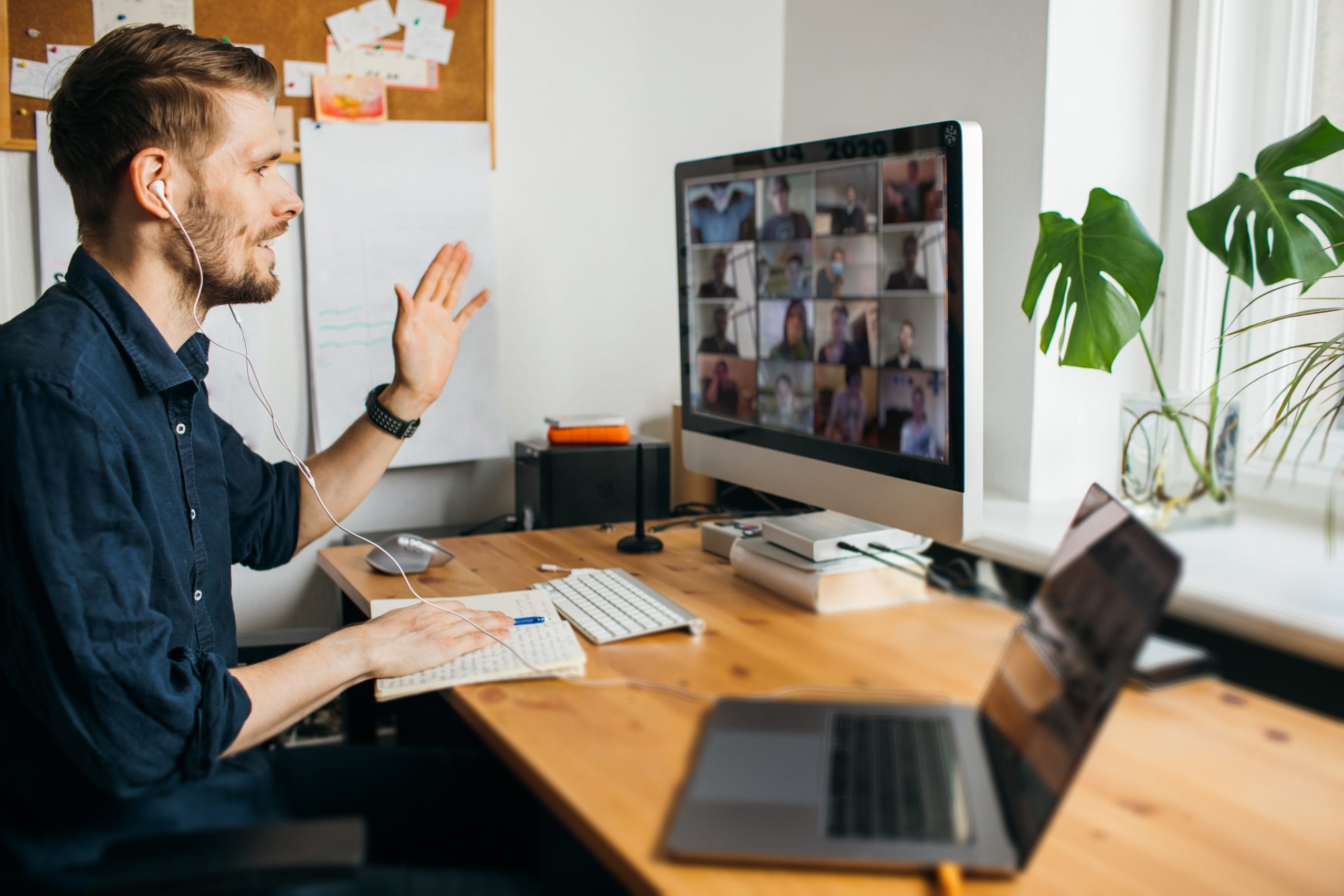 A team discussing construction plans during a Zoom call on a computer screen.