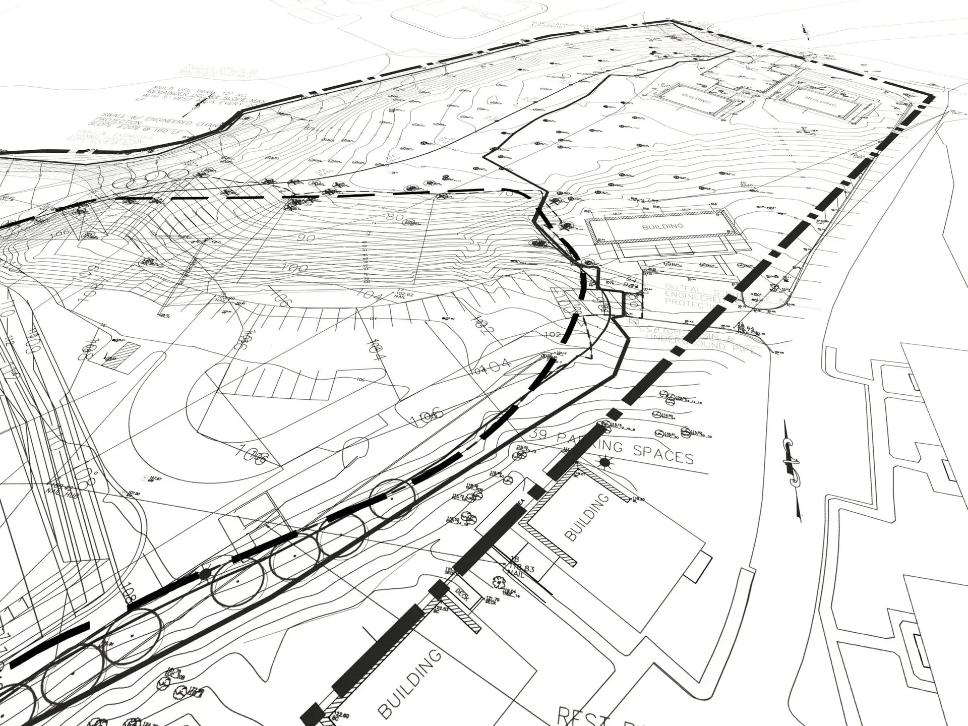 Detailed building site plans on a desk, showcasing architectural layouts, dimensions, and annotations for construction projects.