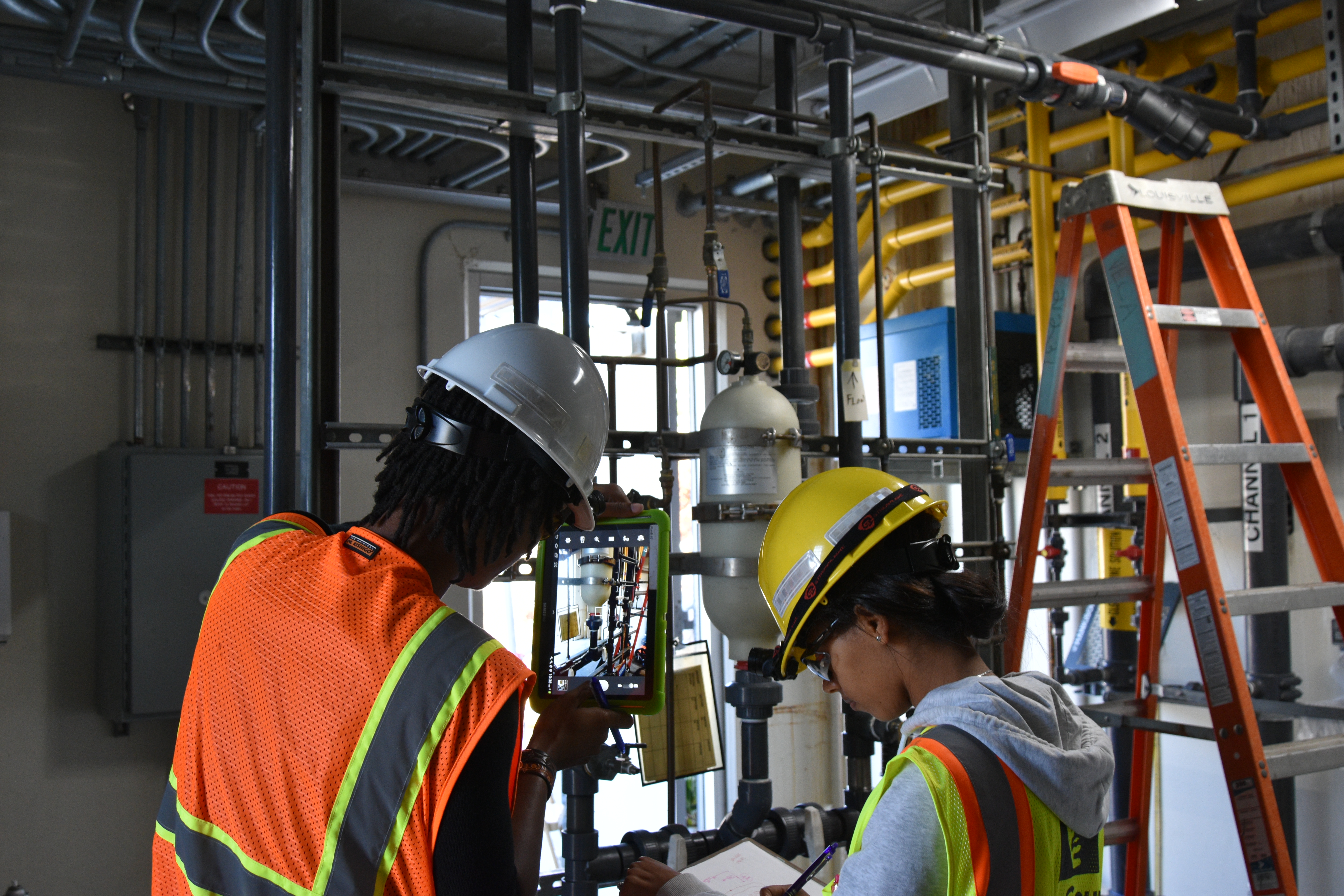 Engineers photograph equipment