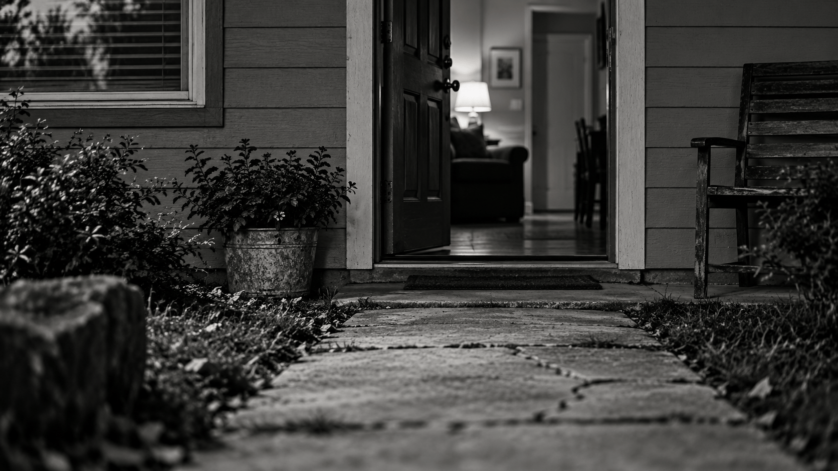 An open front door at the end of a worn path, symbolizing veteran suicide prevention through housing stability and support