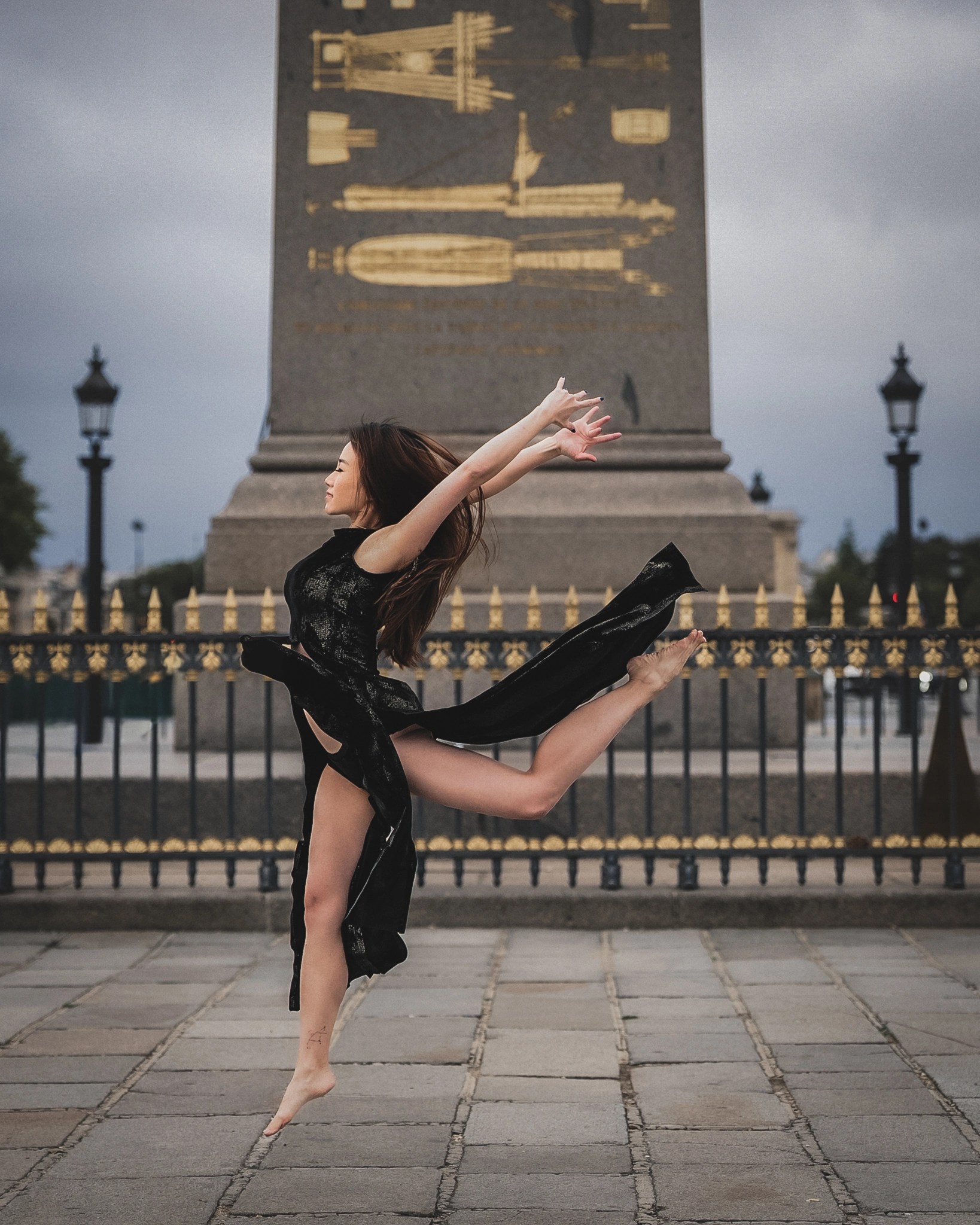 Lily Stadil makes a barefoot dance leap before the Luxor Obelisk