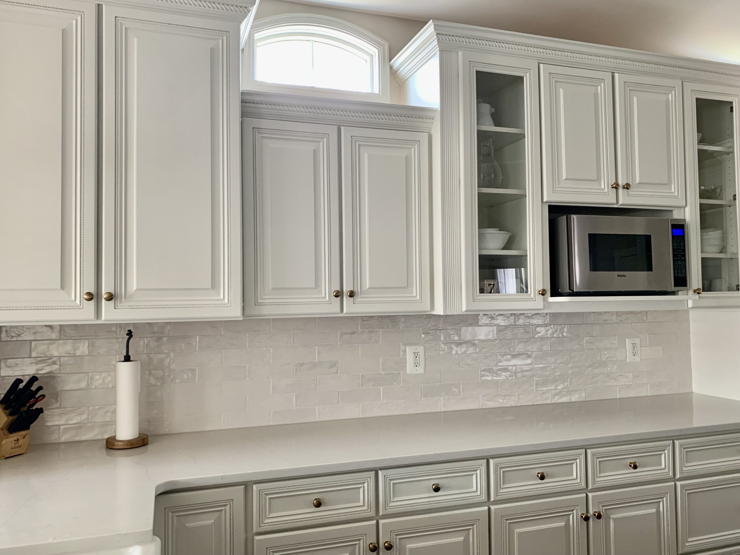 White professionally painted kitchen cabinets
