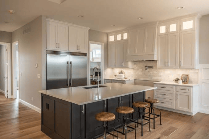 Modern custom kitchen cabinets in a luxury GTA home featuring white shaker cabinetry, quartz countertops, and custom storage solutions.