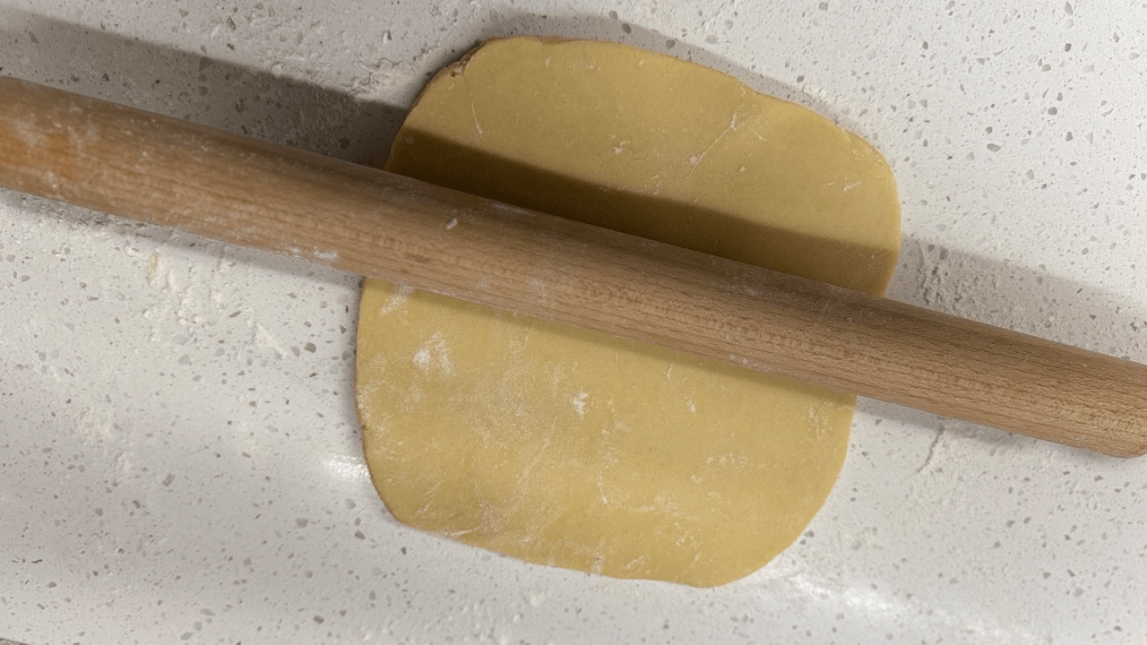 roll the dough for pate sucree tart shell