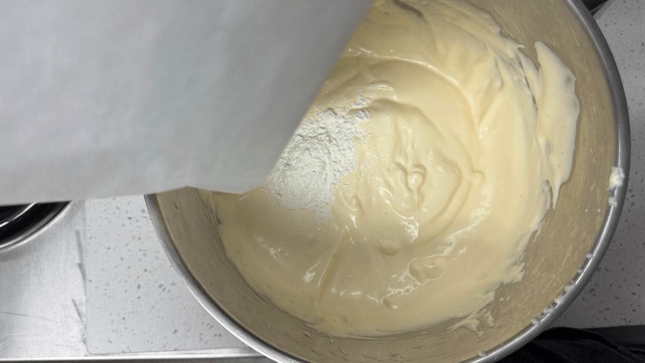 adding flour for sponge cake