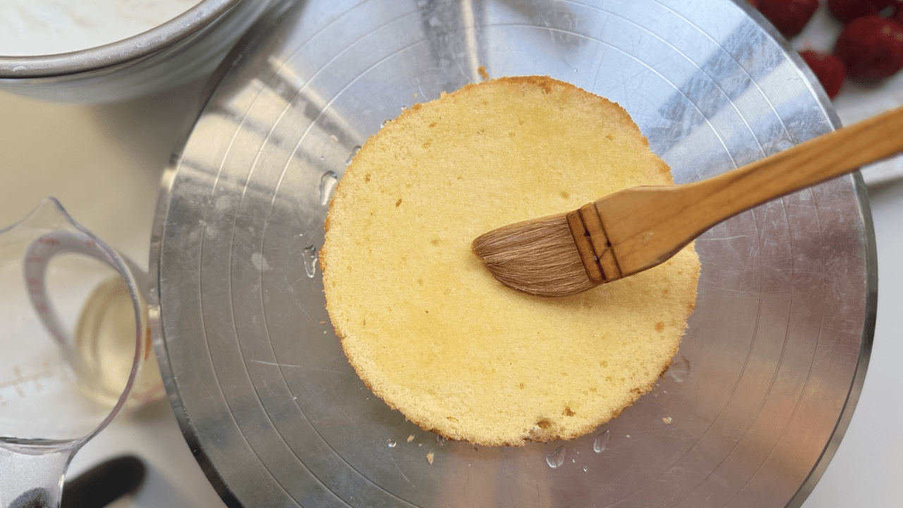 applying the syrup on the Japanese sponge cake for strawberry short cake