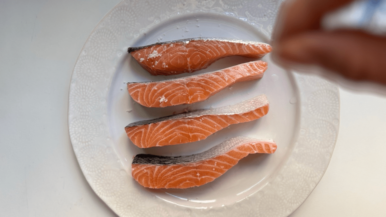 sprinkling the salt for salmon for salmon saikyo yaki