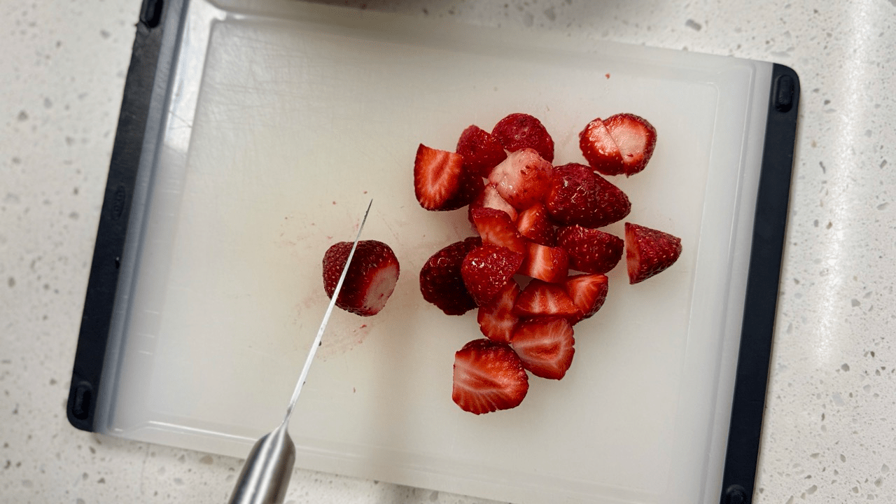 cutting strawberry for strawberry sauce