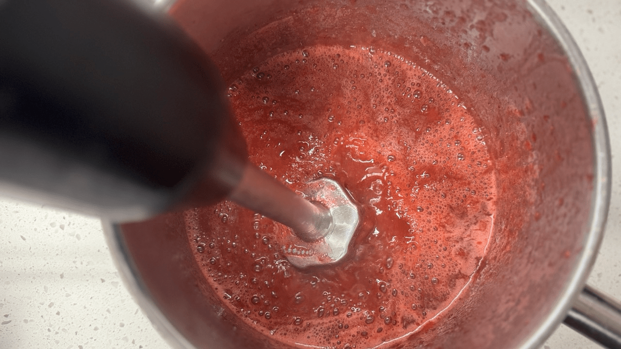 blending strawberry sauce