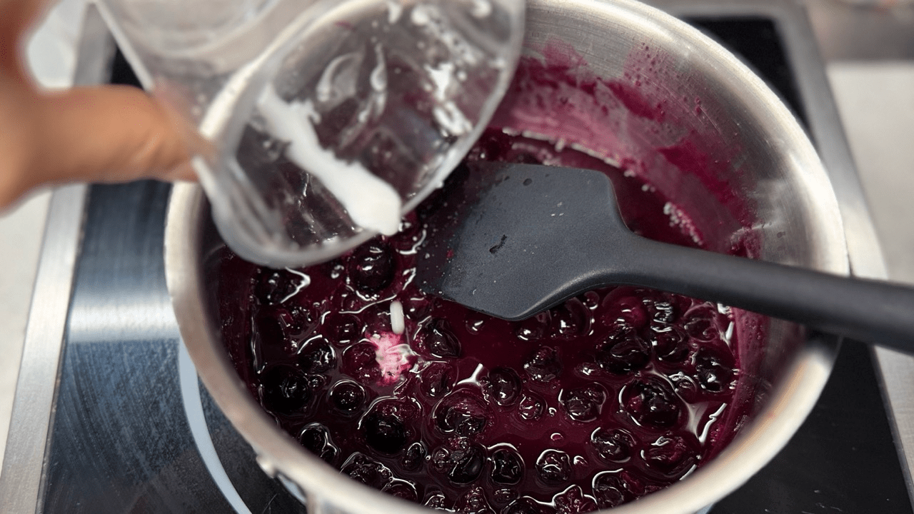 adding corn starch for blueberry sauce
