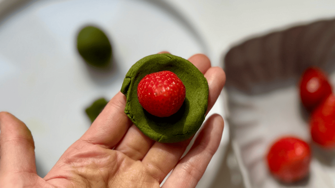wraping strawberry with matcha an