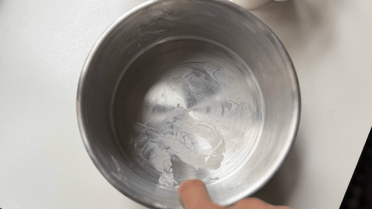 Prepping mold with butter