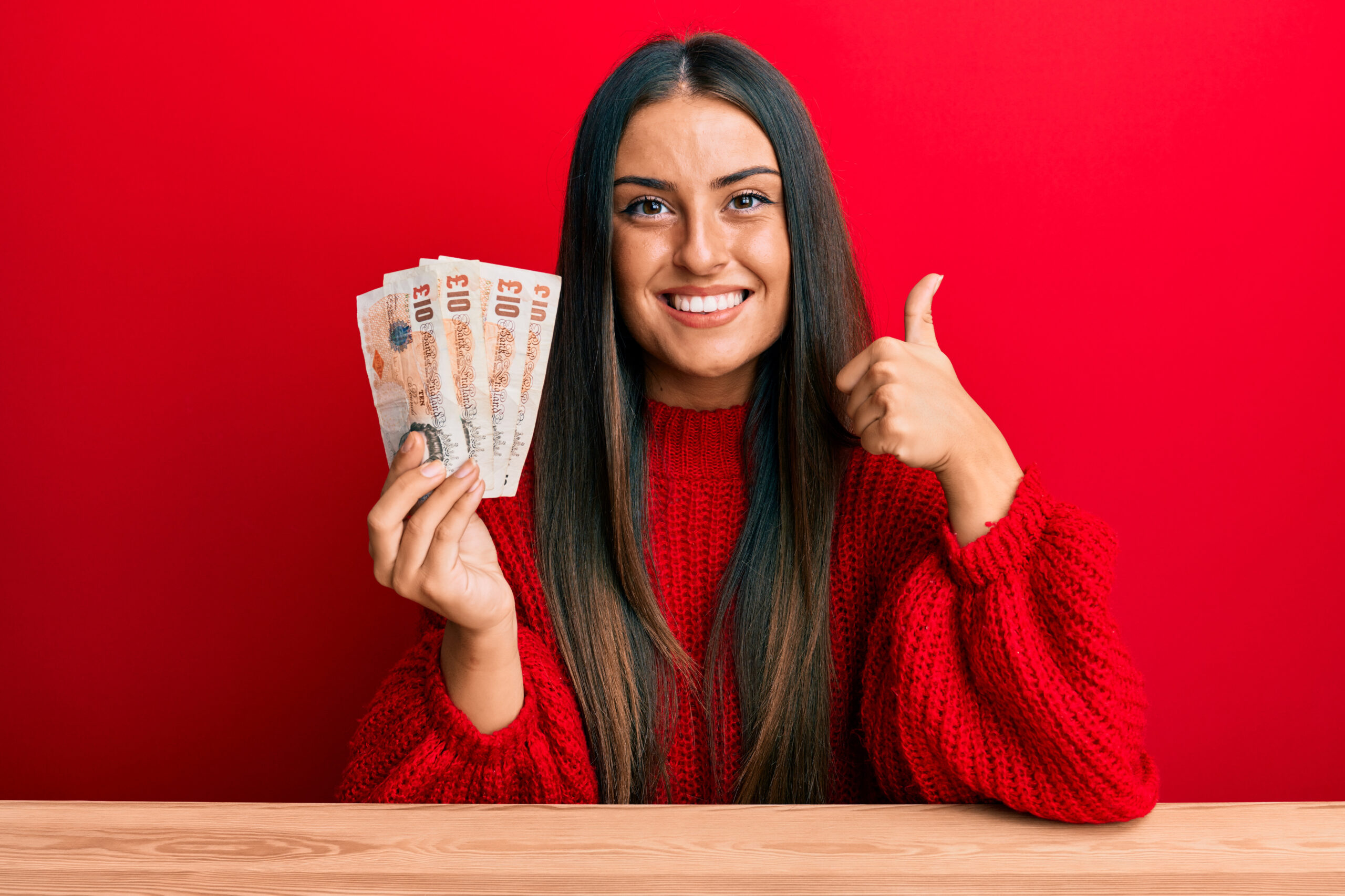 Beautiful,Hispanic,Woman,Holding,United,Kingdom,Pounds,Smiling,Happy,And