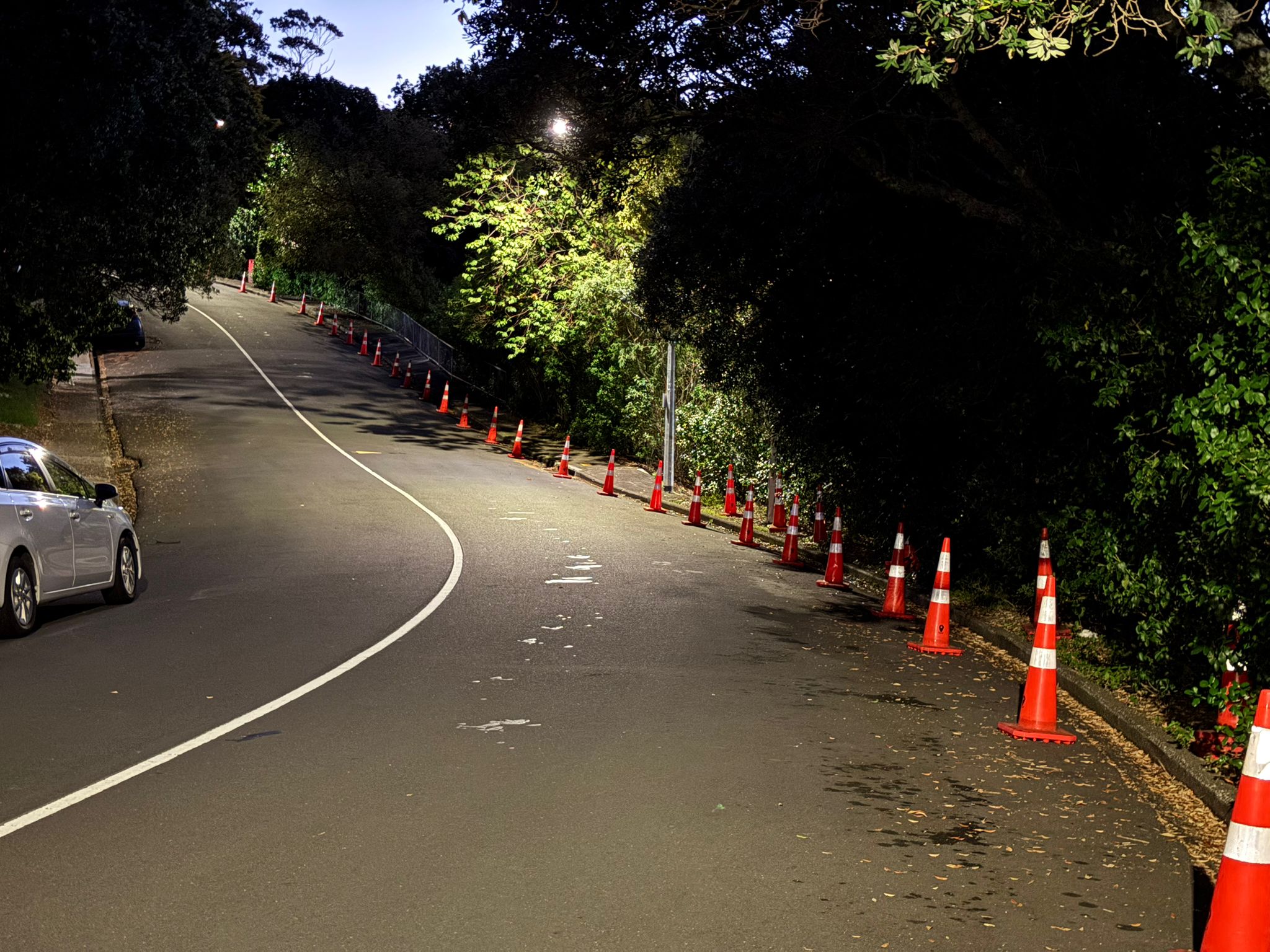 Road cones reserving parking for production trucks