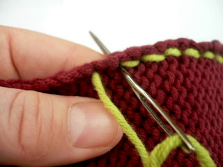 Learn how to knit herringbone stitch for a textured look that's great for knitting home decor and fashion accessories. Knitty Editorial Spring 06