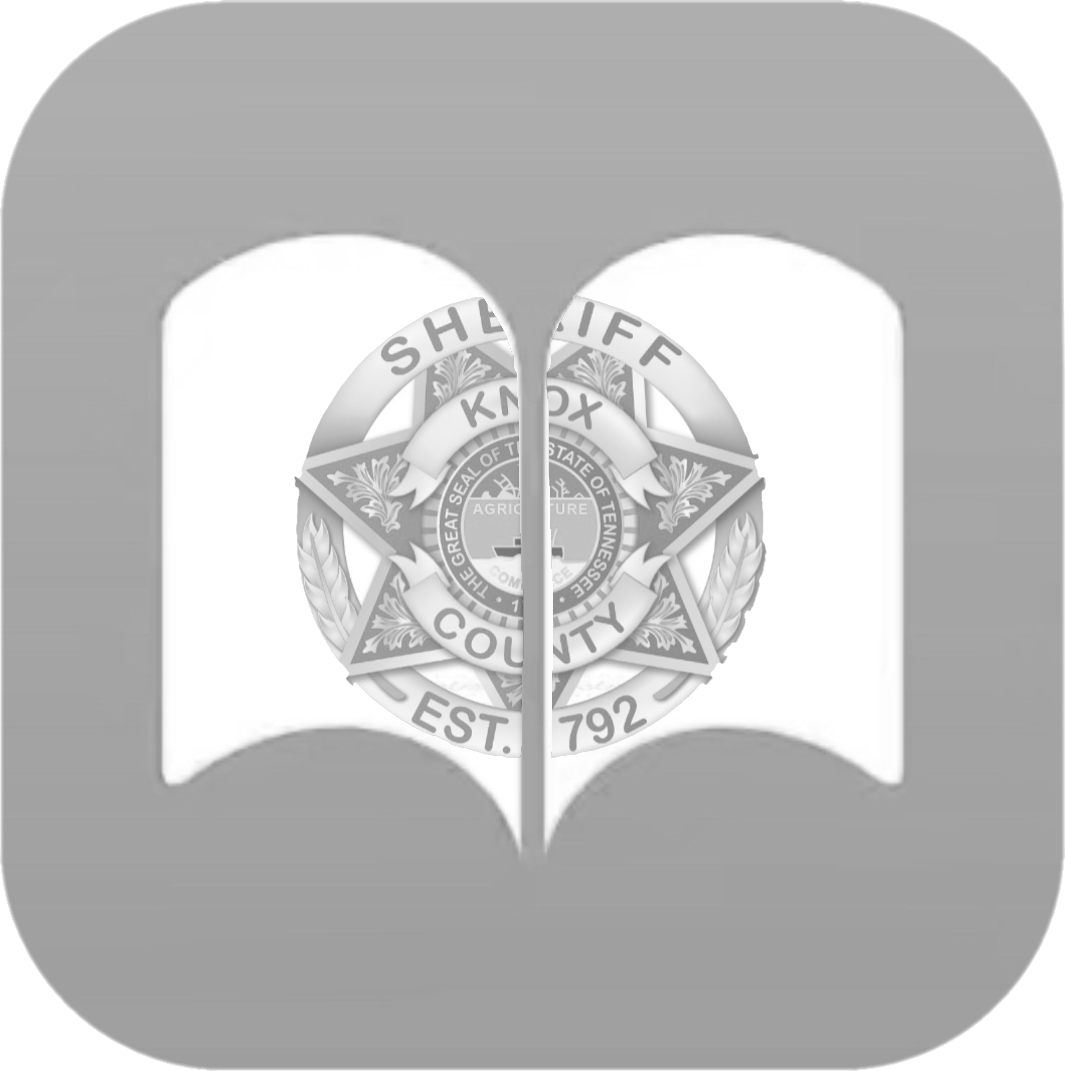 Black and white KCSO badge in open papers