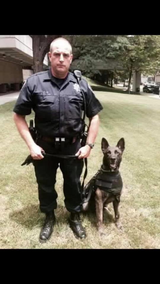 Officer standing with k9