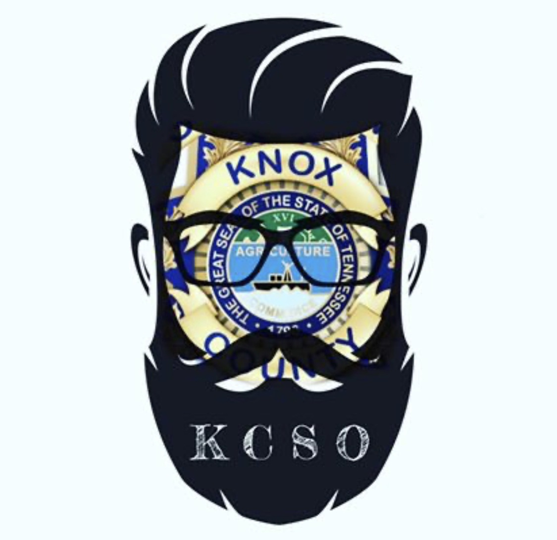 Clipart of man's head with beard and glasses over KCSO badge