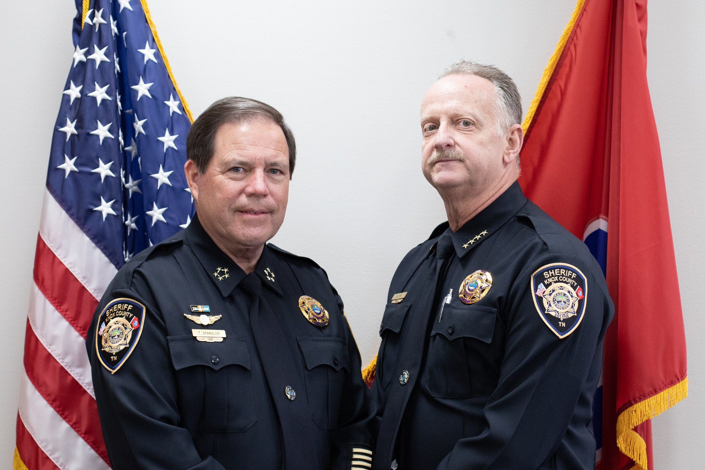Sheriff Spangler standing with Chief Lyon