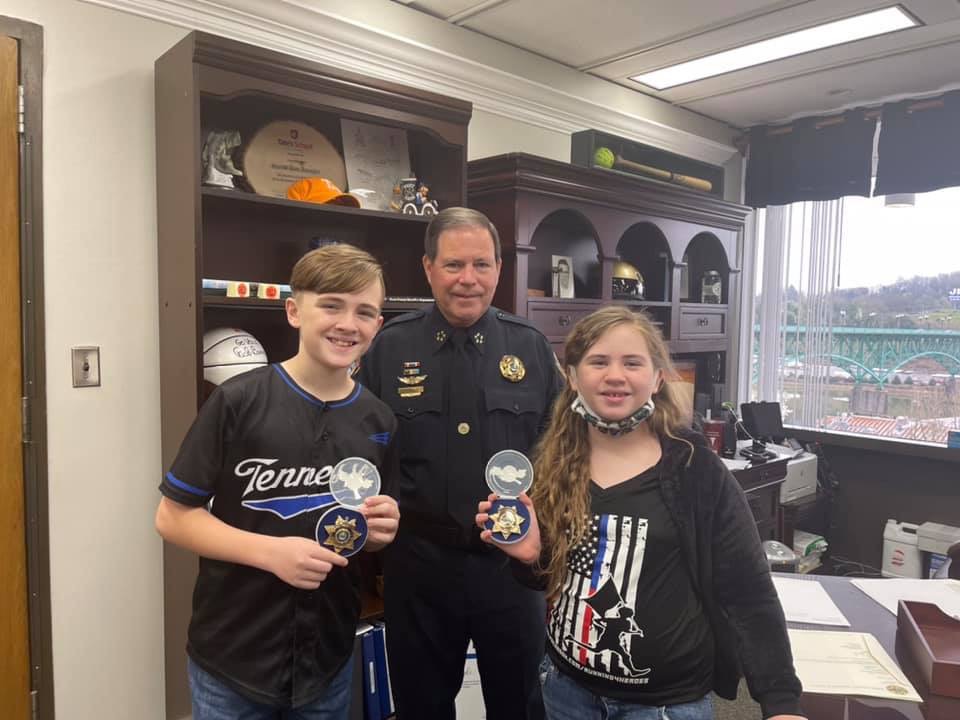 Sheriff, Zachariah, and girl standing in Sheriff's Office