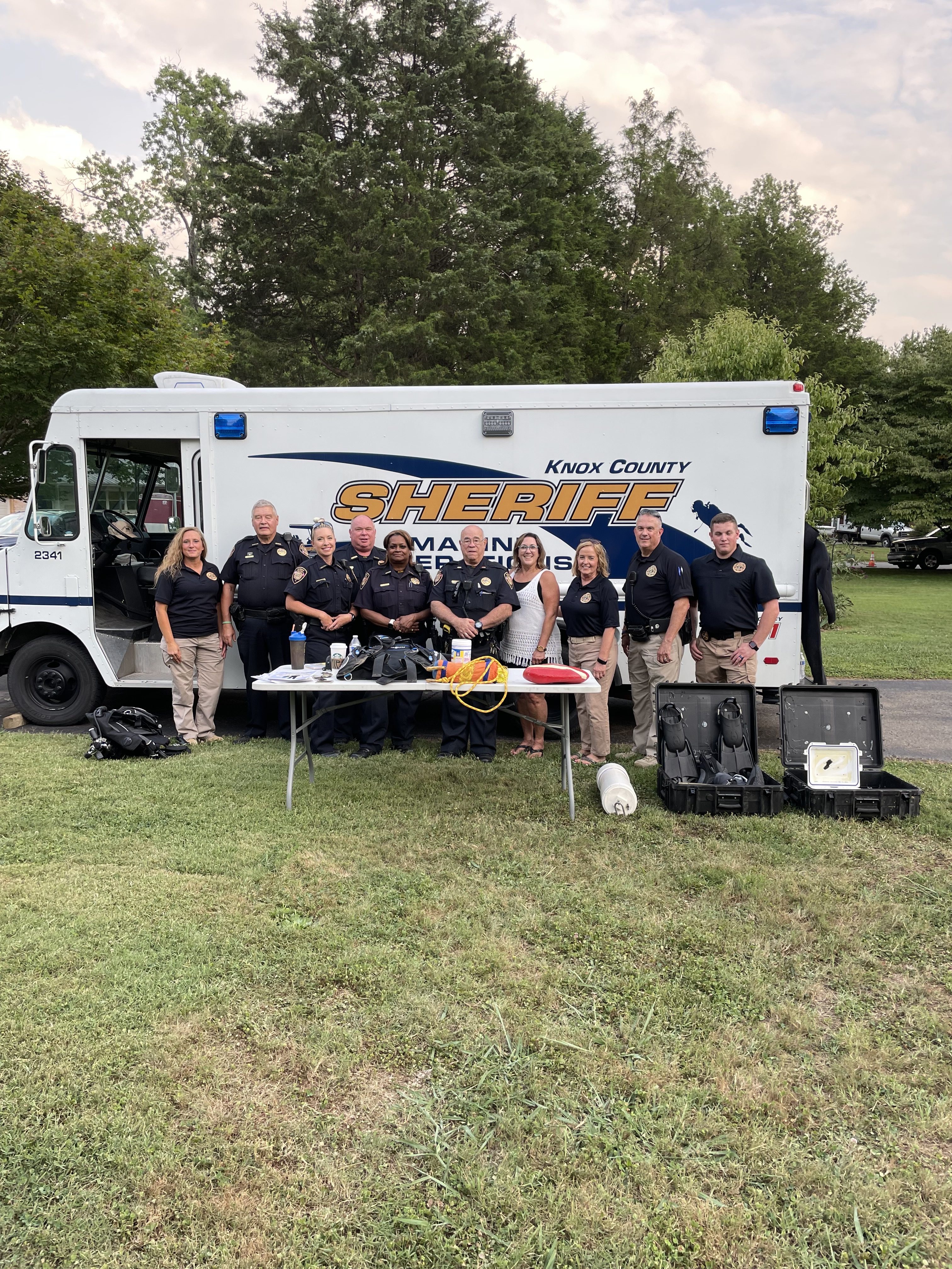 Officers posing in front of KCSO van