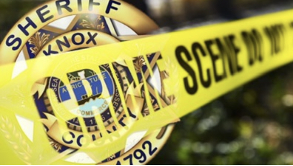 Crime scene tape with KCSO badge background