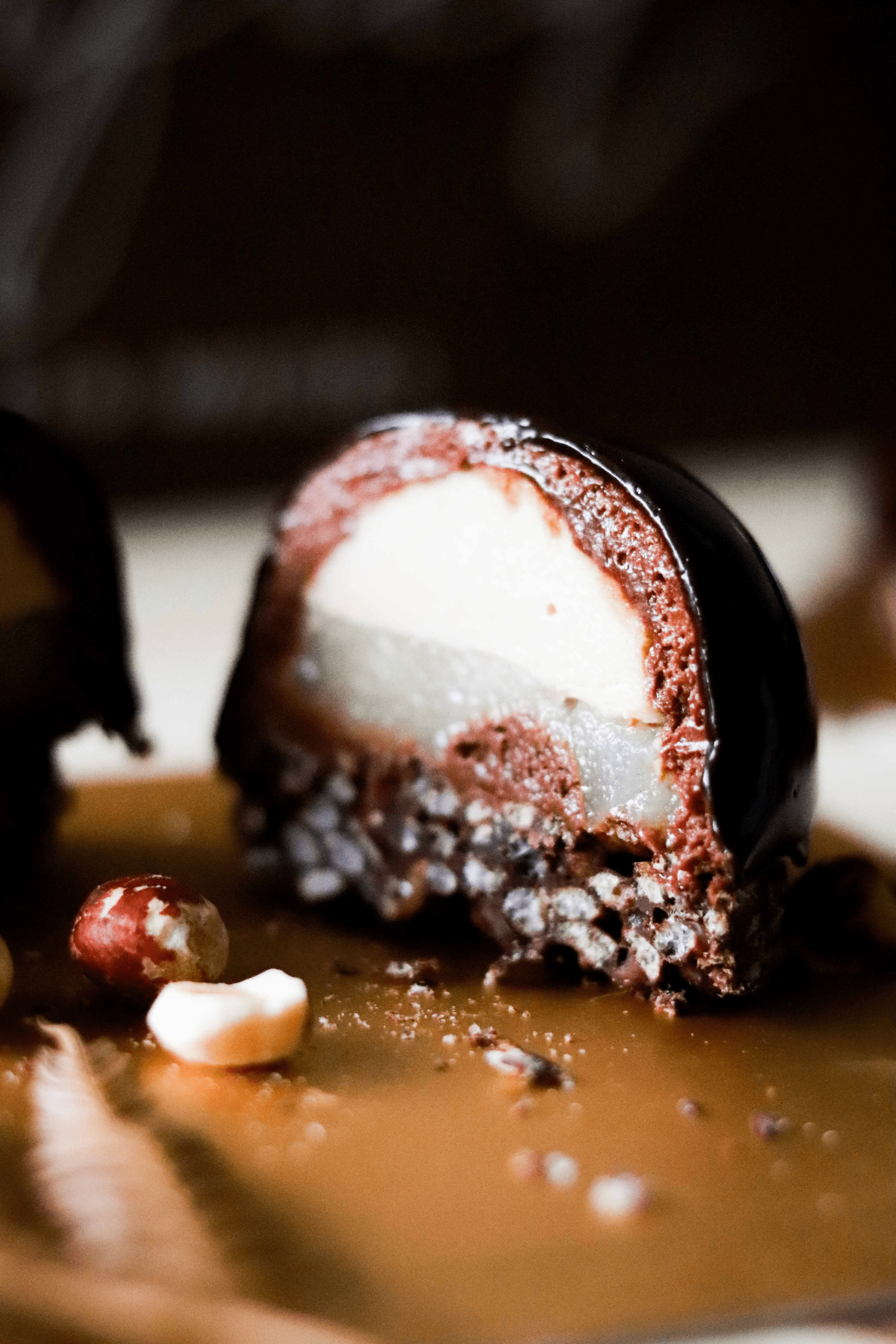 Layers of goodness – Hazelnut Dark Chocolate Mousse Sphere (with Coffee Creme Patissiere & White Wine Poached Pear & Crispy Chocolate Base)