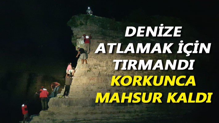 Denize atlamak için tırmandı, korkunca mahsur kaldı