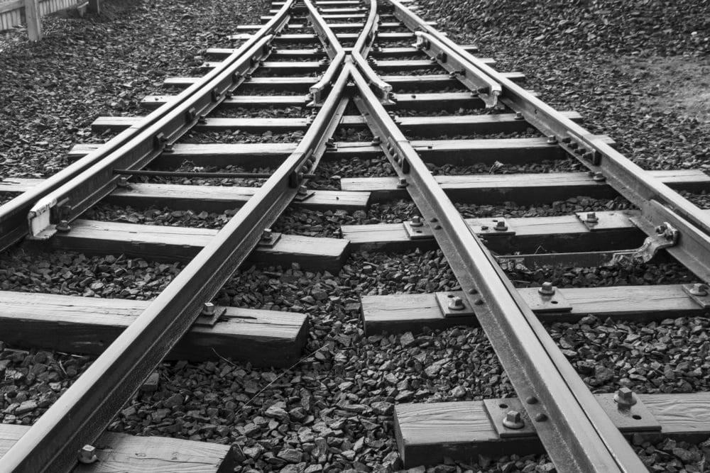 Two-railway-tracks-merge-ImagePortbs.jpg