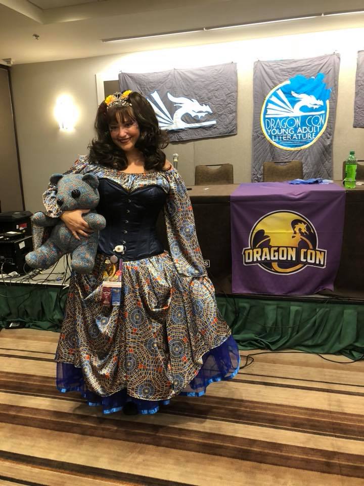 Alethea Kontis with the Marriott carpet bear wearing a Marriot carpet princess dress