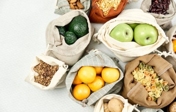 fruits and dried condiments stored in canvas and cloth bags