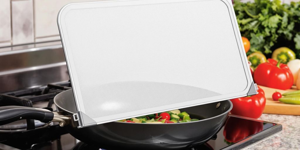 Foldable splatter screen in a compact kitchen.