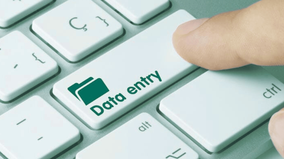 Finger pressing a computer key labeled 'Data entry' with a folder icon, symbolizing the benefits of AI-powered data entry software.
