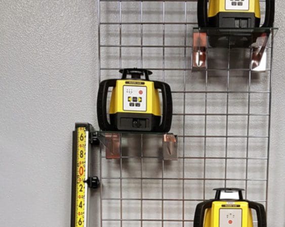 Yellow laser levels displayed on a grid wall.