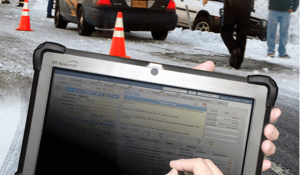 Tablet used at snowy traffic checkpoint.