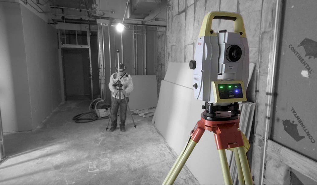 Surveying equipment in use at construction site.