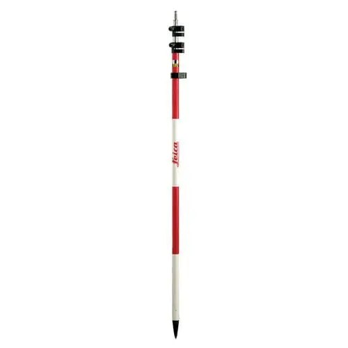 Surveying pole with red and white stripes.