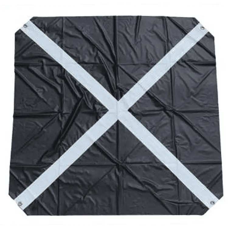 Black tarp with white cross pattern.