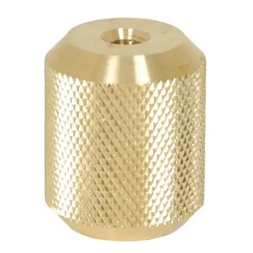 Brass cylindrical fitting with textured surface.