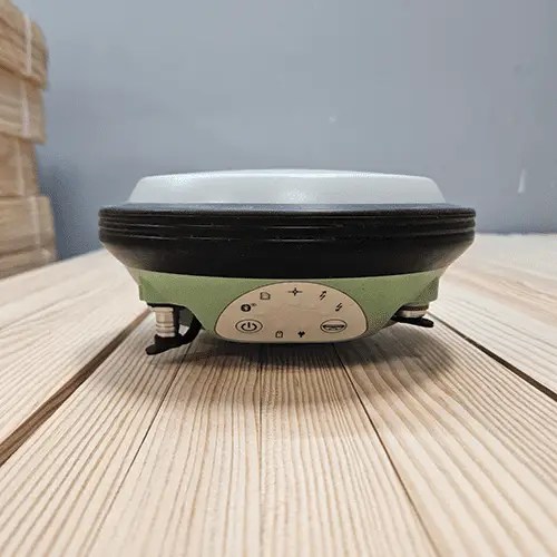 Survey equipment on a wooden surface.