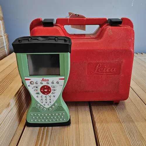 Leica surveying device with red carrying case.