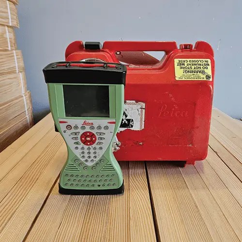 Surveying equipment with red carrying case.