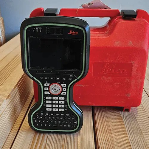 Surveying device with red carrying case.