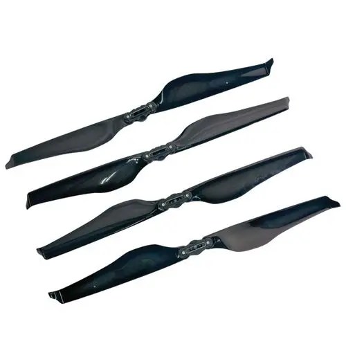 Four black drone propeller blades on display.