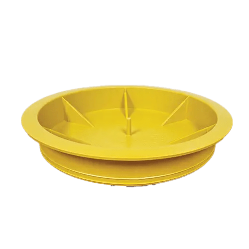 Yellow plastic wheel chock on black background.