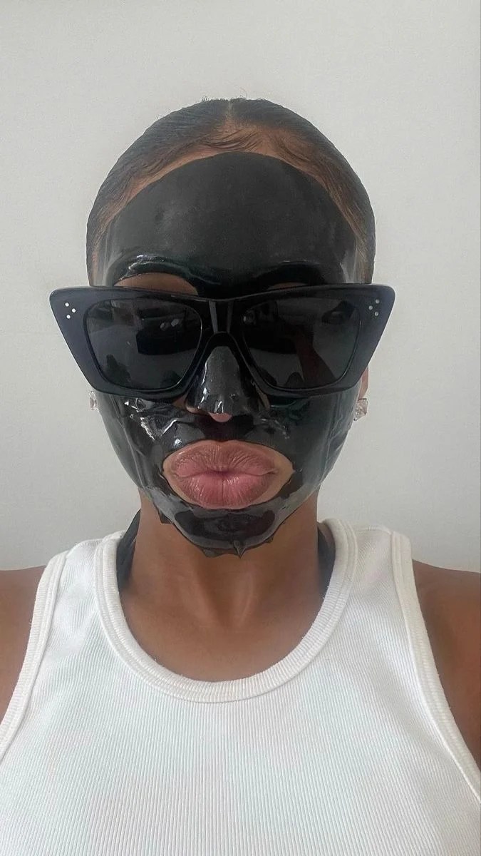 black woman, skincare mask, black sunglasses, luxury skincare rituals