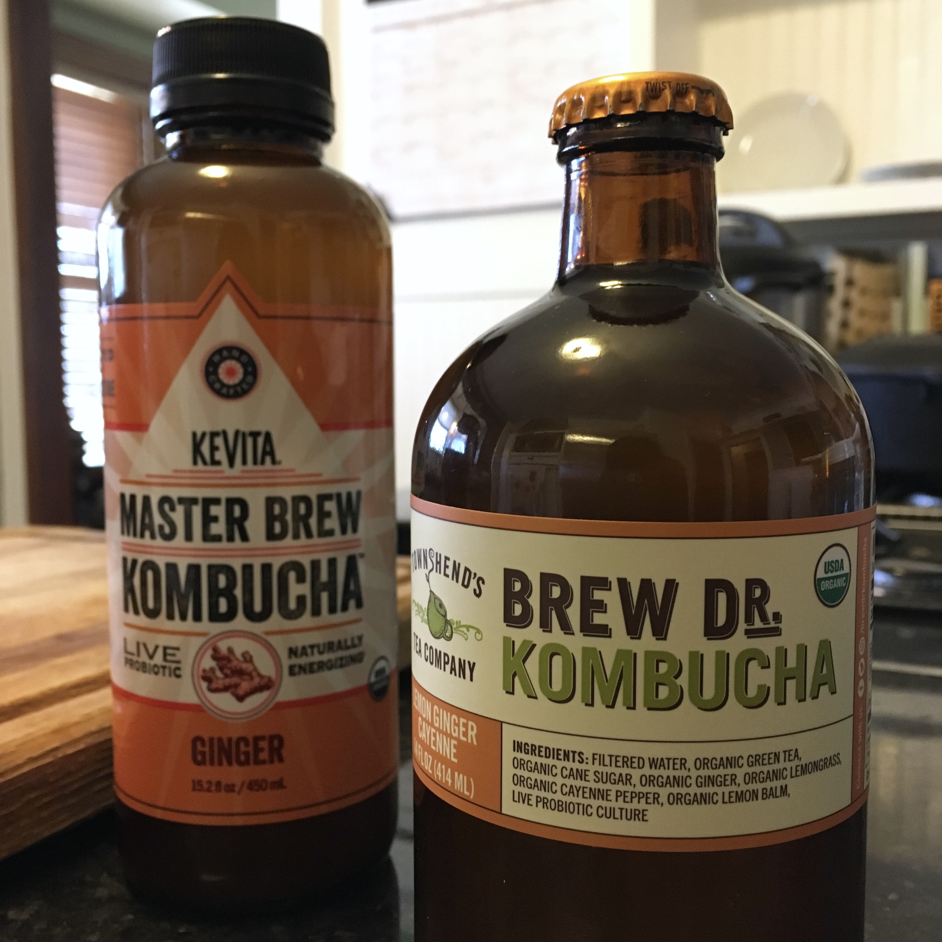 Two bottles of store-bought kombucha