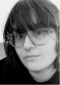 Black and white photo of Nadia Amina Rabbani looking into the camera