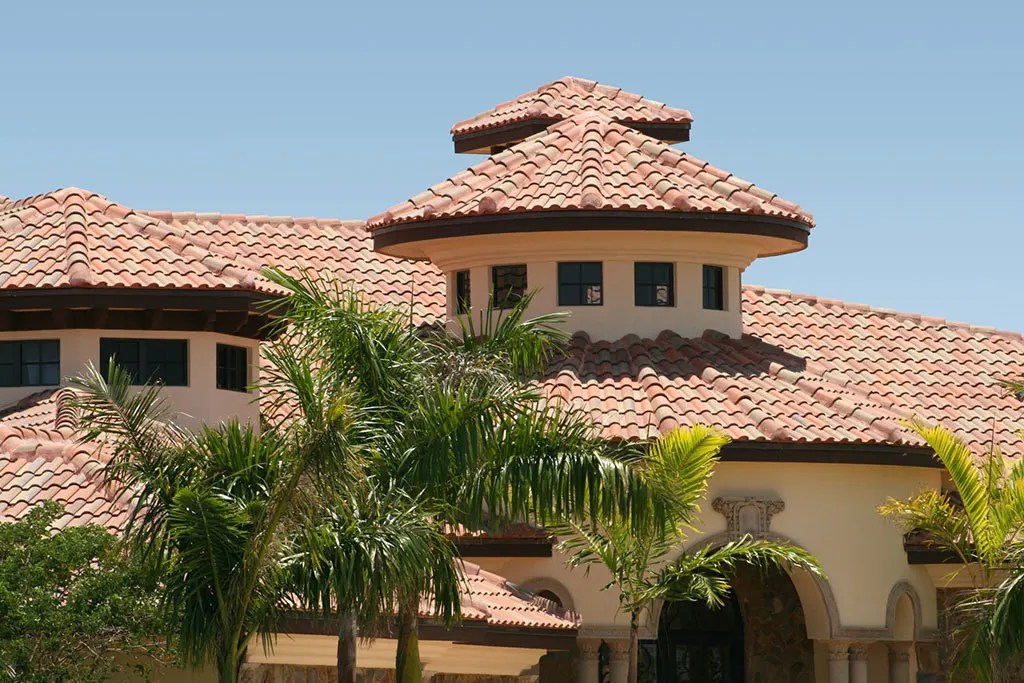 Luxury Spanish clay tile roofing system installed on a Mediterranean style estate in Bee Cave Texas